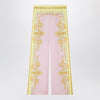 Versace Printed silk twill trousers in yellow/pink