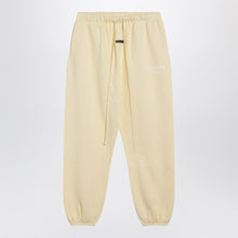  Fear of God Essentials Yellow jogging pants with logo