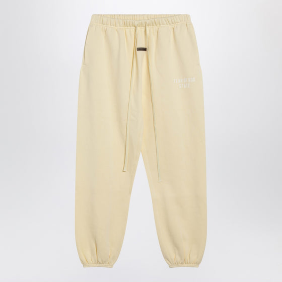 Fear of God Essentials Yellow jogging pants with logo