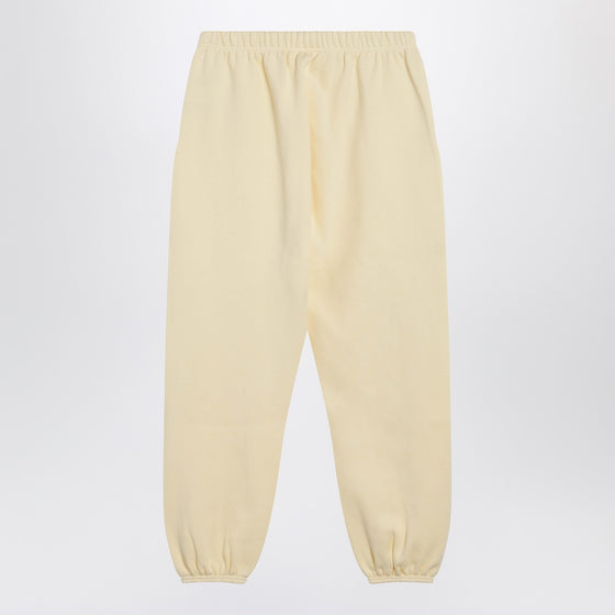 Fear of God Essentials Yellow jogging pants with logo