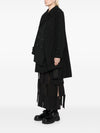 Comme Des Garcons Complete with asymmetrical sleeves