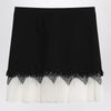 Alexander McQueen Mini skirt with black/ivory spider lace