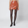 THE ANDAMANE Leather-effect mini skirt in tan