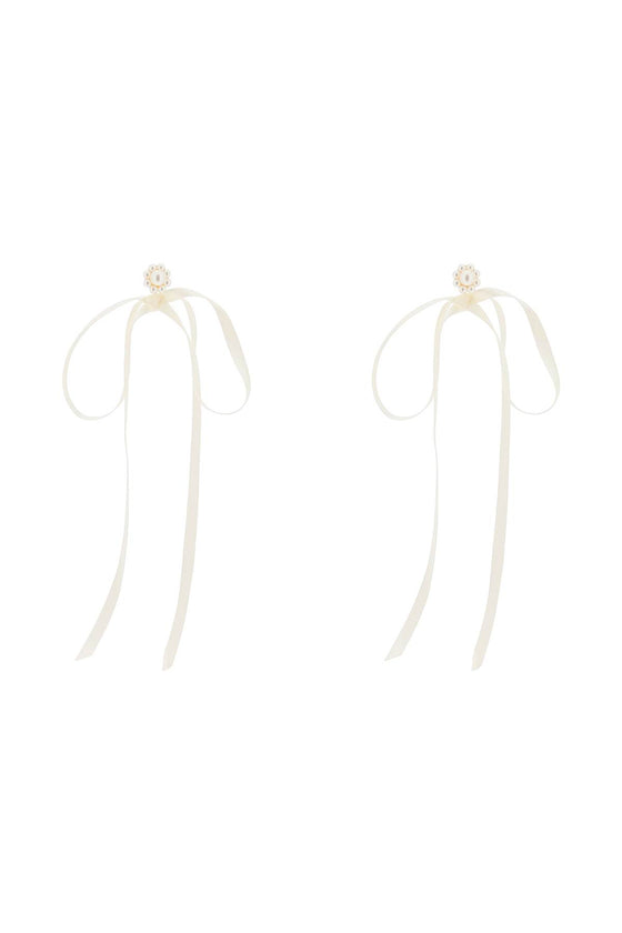 Simone rocha button pearl earrings with bow detail.